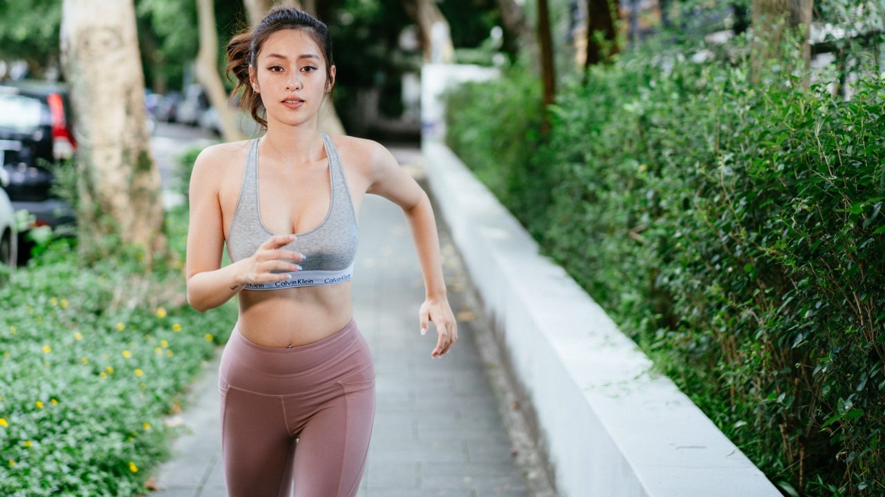 girl running through neighborhood