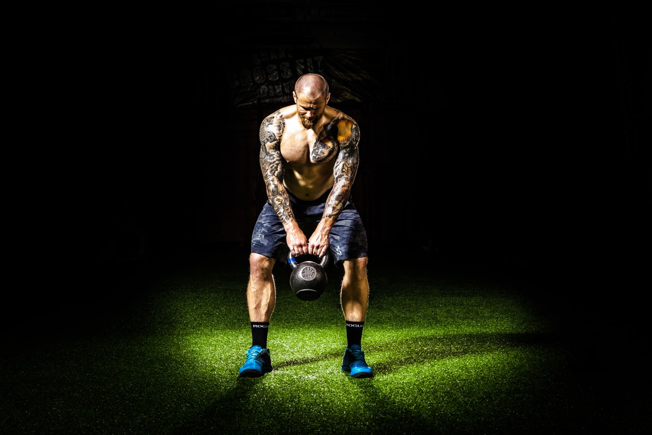 man kettlebell swing dark