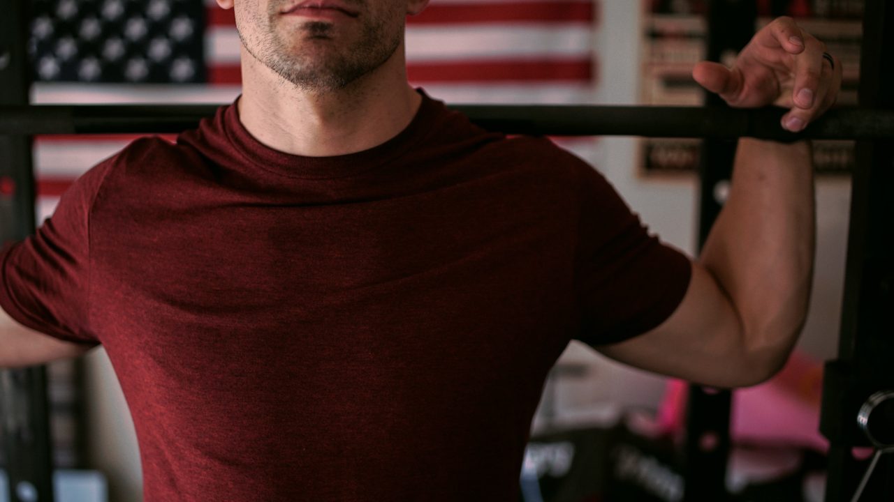 man with bar gaining muscles and losing weight