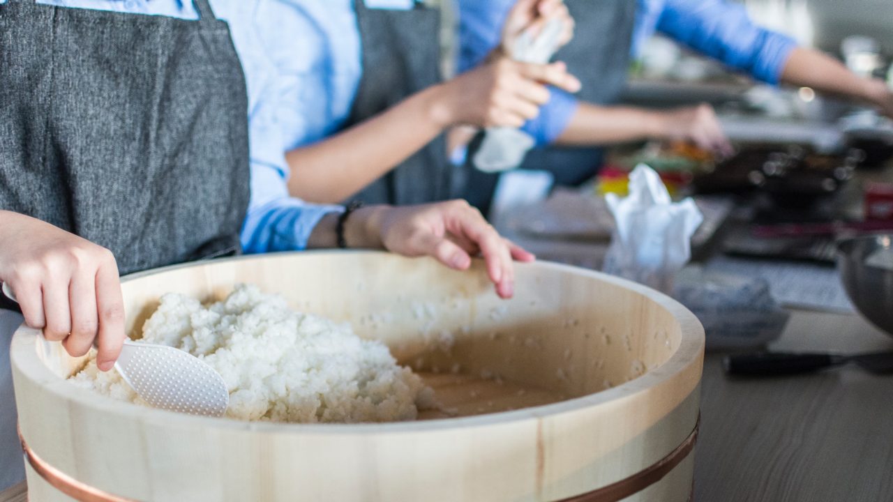 close up scooping white rice