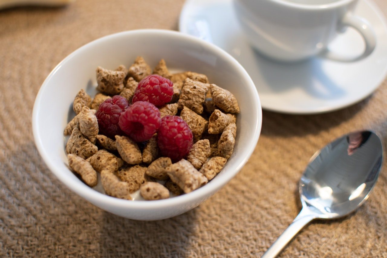 close up cereal with raspberries