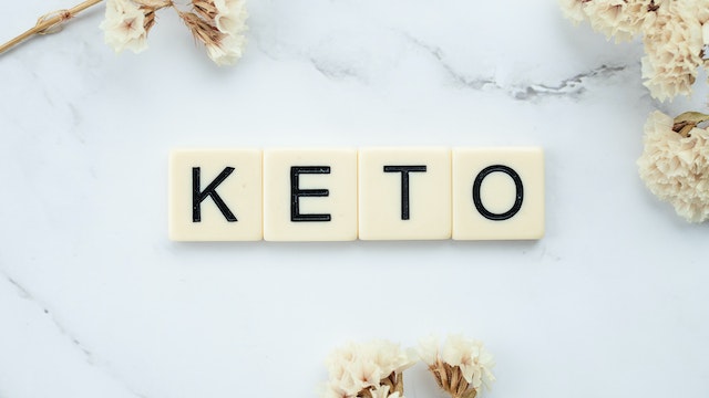 Scrabble word tiles on a counter spelling keto.