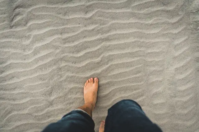 Barefeet in the sand. 