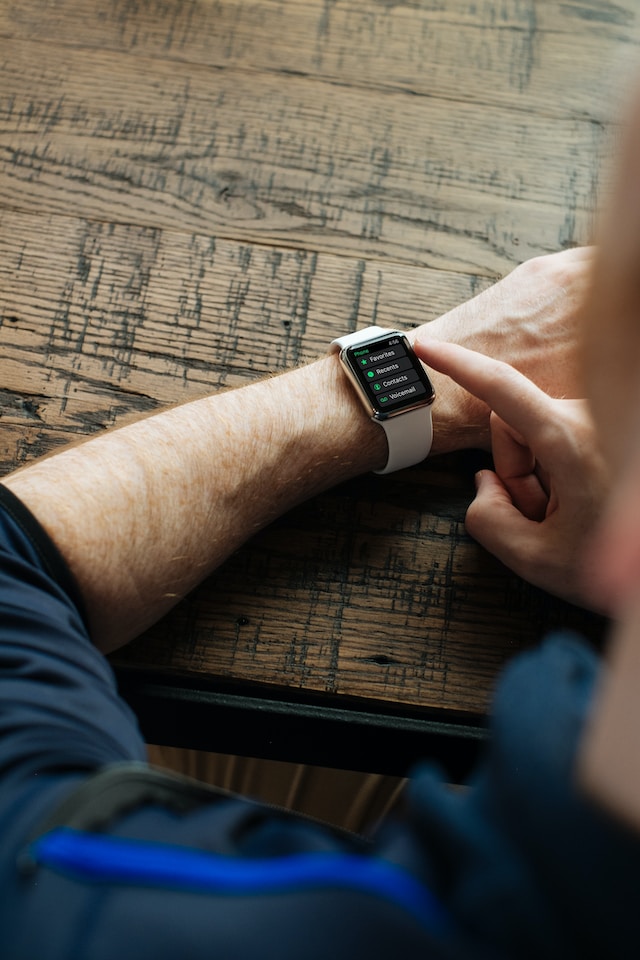 A man checking his smartwatch messages.