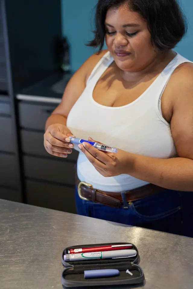A woman holding an injection.