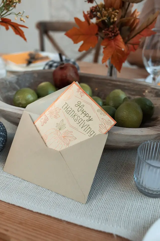 A happy thanksgiving greeting card on a small brown envelope.