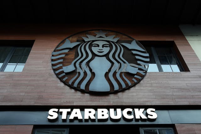 A big Starbucks logo on a building.